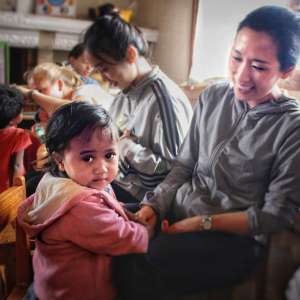 Greenlife dentist hanging out with children at rural area